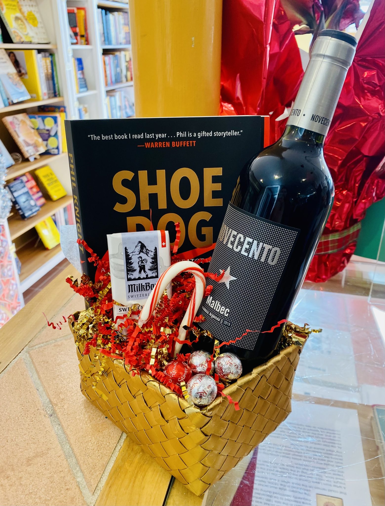 books and wine in basket